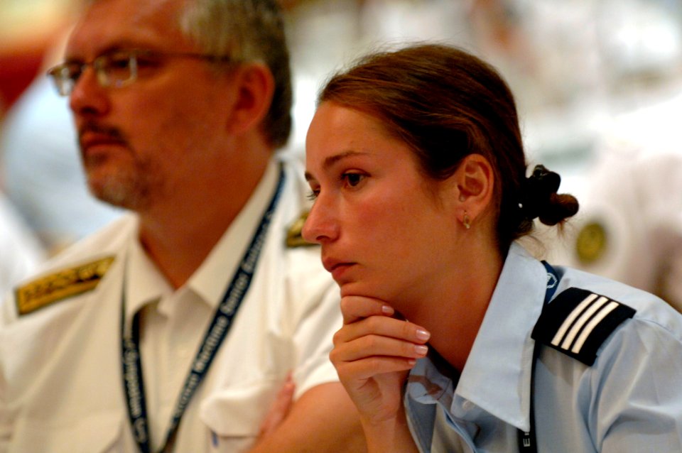 US Navy 080922-N-9818V-174 Warrant Officer Ekaterine Batsikadze and Dietmar Donner isten to presentations during the second Global Maritime Senior Enlisted Sailor Symposium