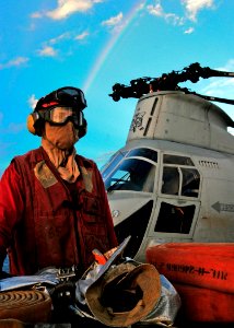 US Navy 080923-N-4010S-033 Aviation Boatswain Mate (Handler) Airman Cody Nickles stands at the ready position