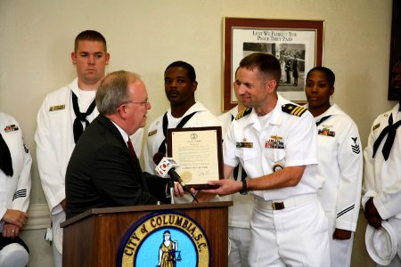 US Navy 080923-N-3271W-031 Cmdr. Joe Klein, commanding officer of Navy Recruiting Command, Raleigh, is presented with a Columbia Navy Week proclamation from Mayor Bob Coble photo
