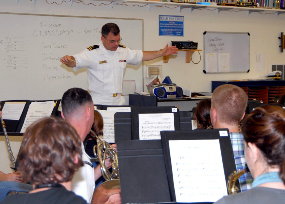 US Navy 080923-N-4649C-004 Lt.j.g. Patrick Sweeten conducts a music class at McNary High School