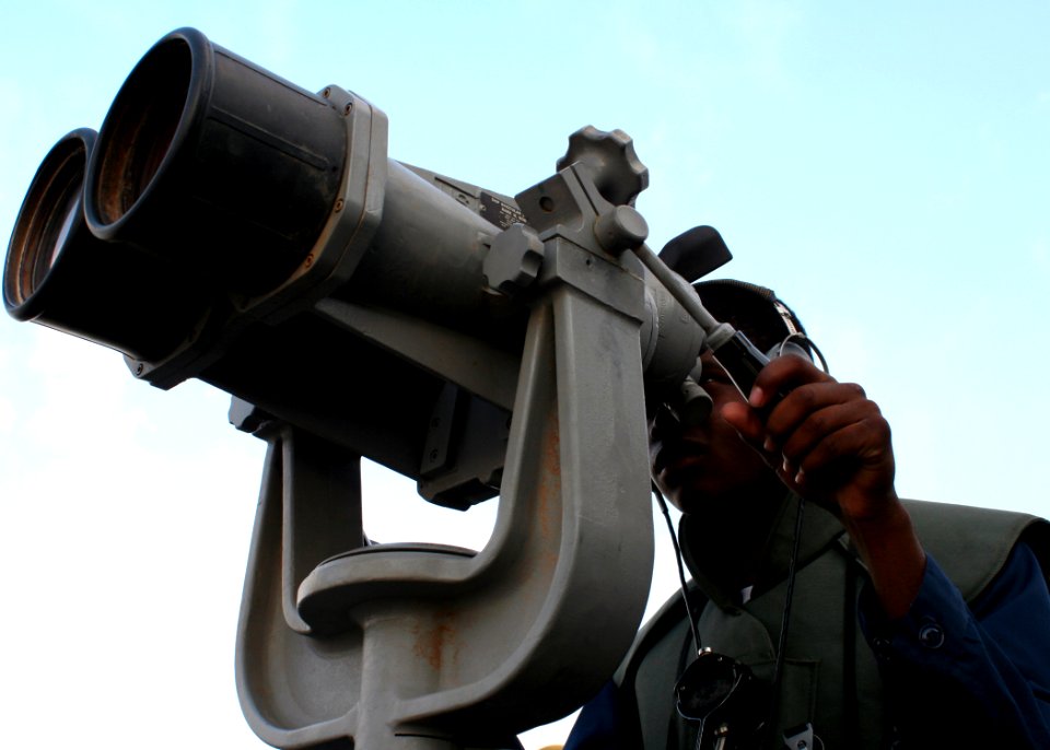 US Navy 080923-N-6764G-015 Seaman Brandon Lewis scans the horizon while transiting the Suez Canal