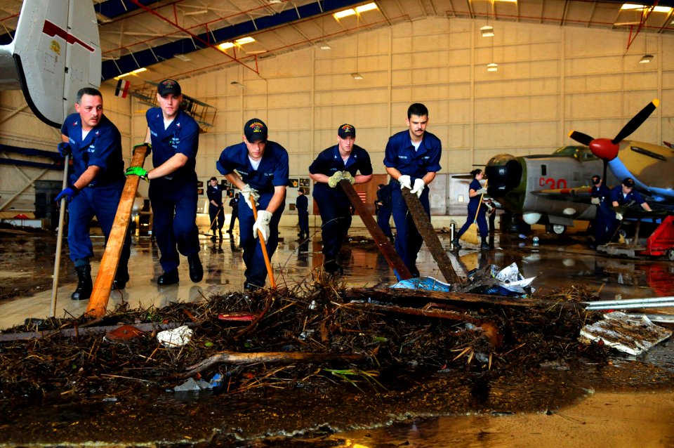 US Navy 080921-N-5758H-582 Sailors assigned to the amphibious assault ship USS Nassau (LHA 4), move sewage waste and debris from the Lone Star Flight Museum in Galveston