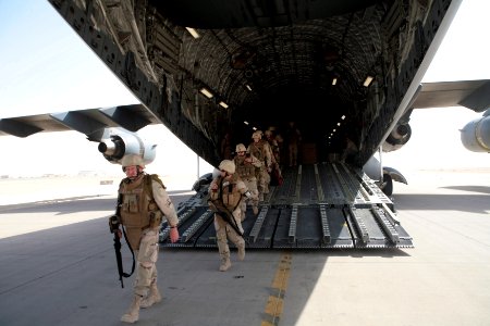 US Navy 080922-N-9623R-052 Seabees exit an Air Force transport aircraft