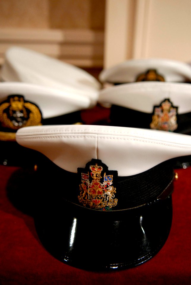 US Navy 080922-N-9818V-068 Covers belonging to senior enlisted members of navies around the world are placed on a table