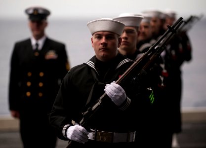 US Navy 101227-N-7981E-300 A rifle platoon prepares to depart at the conclusion of a burial at sea aboard USS Carl Vinson (CVN 70) photo