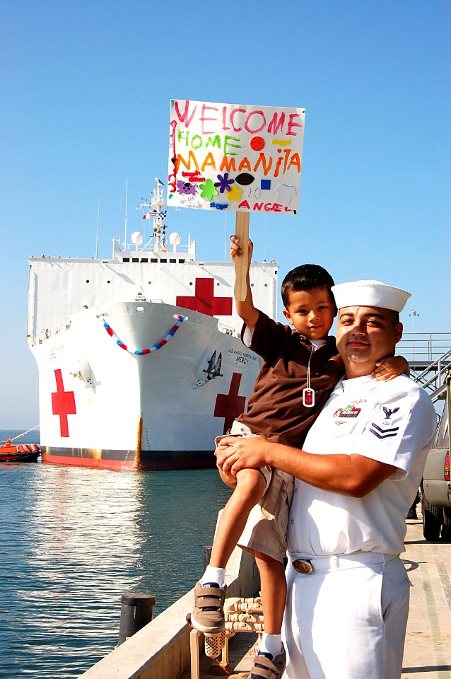 US Navy 080925-N-3570S-028 Electronic's Technician 2nd Class Jose Angel Alcala holds his six-year old son