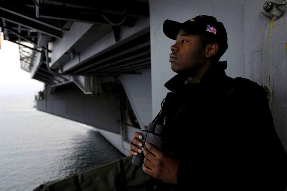 US Navy 080927-N-4954I-004 Seaman Marshall Everett mans the starboard lookout as the Nimitz-class aircraft carrier USS John C. Stennis (CVN 74) begins her entrance into Coronado Bay for a scheduled port visit