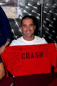 US Navy 080924-N-4005H-142 Scott Stapp holds up a Crash and Salvage team flight deck jersey given to him during an autograph session