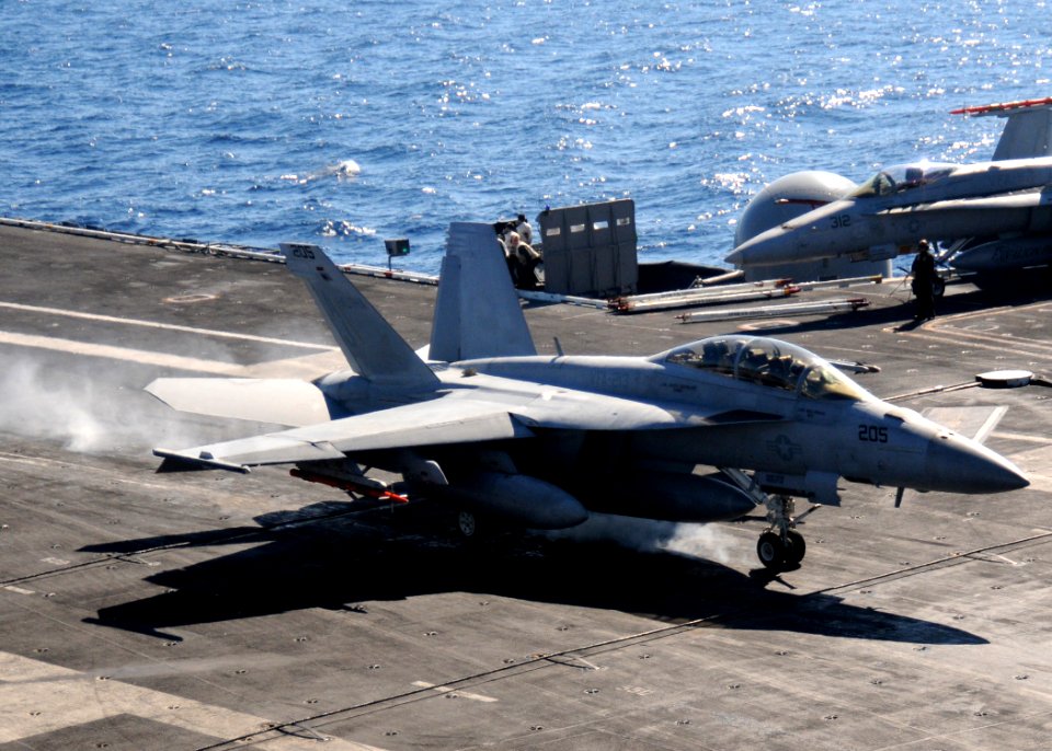 US Navy 110129-N-7004H-117 An F-A-18F Super Hornet lands aboard USS George H.W. Bush (CVN 77)