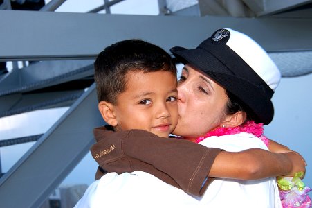 US Navy 080925-N-3570S-116 Hospital Corpsman 2nd Class Maria Collins-Alcala kisses her six-year old son photo