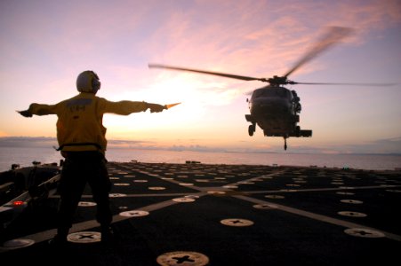 US Navy 080925-N-8487G-639 Aviation Boatswain's Mate Handling Gerson Rivadenera launches an SH-60 Sea Hawk