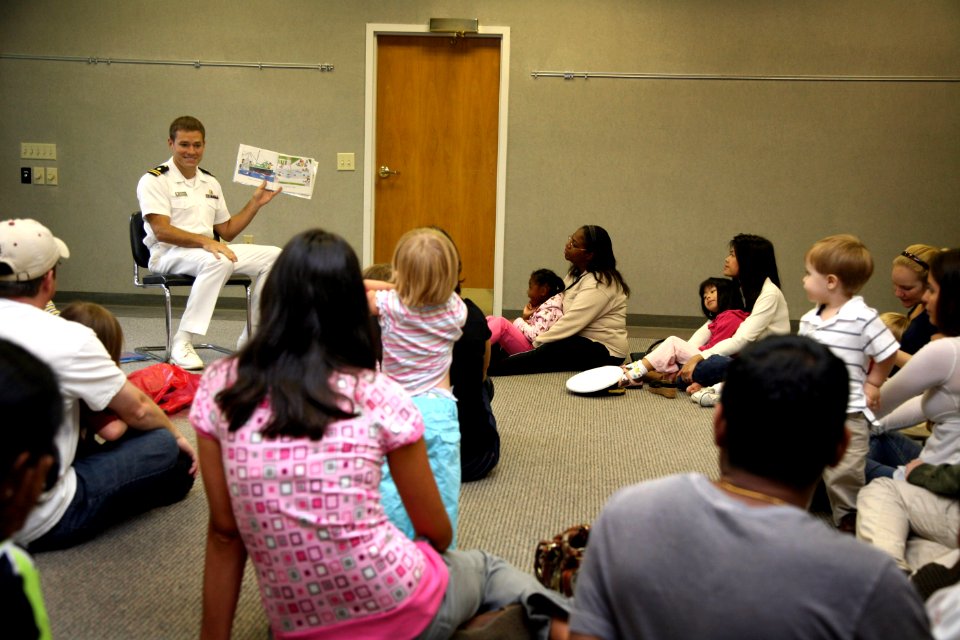 US Navy 080927-N-3271W-065 Lt. Andrew Baldwin, M.D., reads to kids at the Richland Branch Library