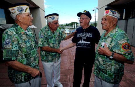 US Navy 080926-N-9758L-125 Seaman 1st Class George E. Laws speaks with Pearl Harbor survivors Sterling Cale, Alfred Rodrigues and Herb Weatherwax at the USS Arizona Memorial Visitor Center
