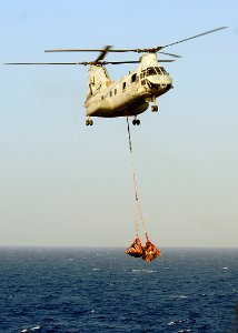 US Navy 080924-N-1082Z-030 A CH-46E Super Stallion conducts a vertical replenishment with the guided-missile cruiser USS Vella Gulf (CG 72)