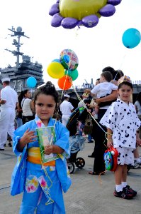 US Navy 080925-N-8546L-324 A family embraces the Japanese culture and wears yukatas as they wait for USS George Washington (CVN 73)