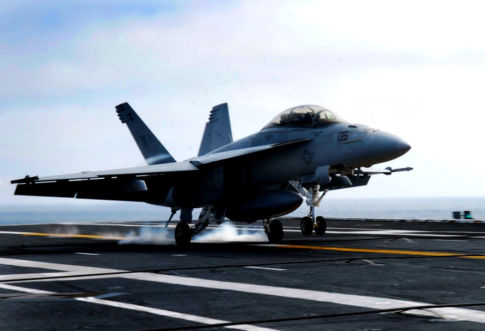 US Navy 080928-N-2610F-013 An F-A-18F Super Hornet lands on the flight deck of the Nimitz-class aircraft carrier USS John C. Stennis (CVN 74)