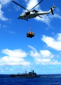US Navy 080929-N-2183K-041 An MH-60S Sea Hawk carries a cargo pendant photo