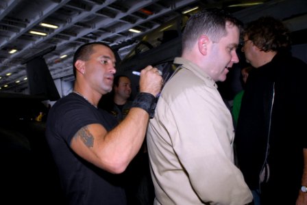 US Navy 080925-N-4995K-032 Scott Stapp signs an autograph for Lt. Ronald Flanders