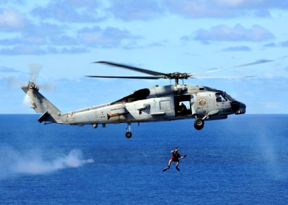 US Navy 080929-N-7981E-498 A rescue swimmer is hoisted back into an SH-60B Sea Hawk helicopter assigned to the
