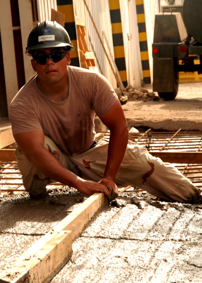 US Navy 080929-N-3560G-286 Steelworker 3rd Class Arnoldo Sotorivas removes excess concrete