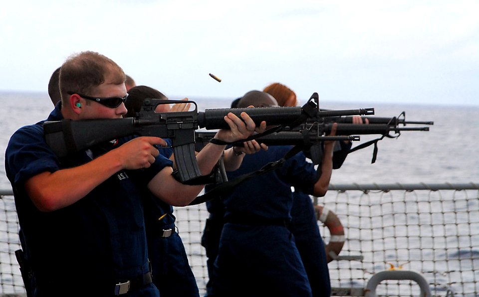 US Navy 080930-N-2013O-001 Sonar Technician (Surface) 3rd Class Owen West, from Chataignier, La., fires an M-16 during weapons qualifications aboard the guided-millile destroyer USS Mustin (DDG 89)