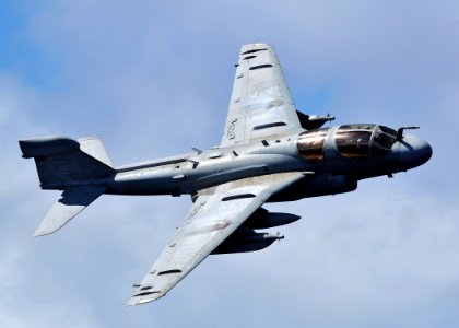 US Navy 080929-N-7981E-102 An EA-6B Prowler banks over the Nimitz-class aircraft carrier USS Abraham Lincoln (CVN 72)