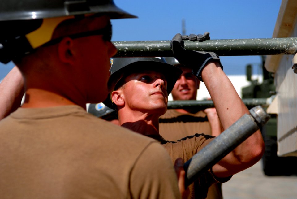 US Navy 080930-N-3674H-076 Seabees attach a section of a medium girder bridge