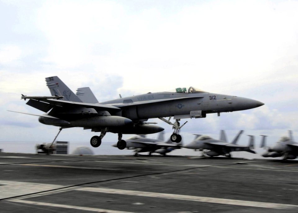 US Navy 080930-N-9988F-002 An F-A-18C Hornet prepares to recover onto the flight deck of the Nimitz-class aircraft carrier USS Dwight D. Eisenhower (CVN 69)