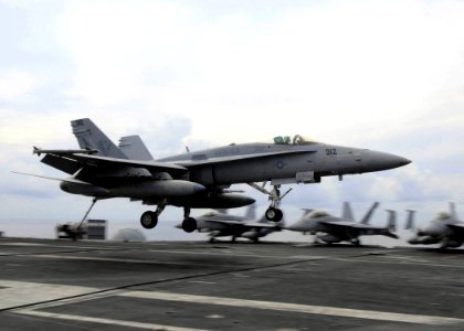 US Navy 080930-N-9988F-002 An F-A-18C Hornet prepares to recover onto the flight deck of the Nimitz-class aircraft carrier USS Dwight D. Eisenhower (CVN 69)