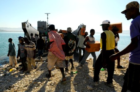 US Navy 080926-N-4515N-064 Members from Assault Craft Unit 2 bring disaster relief supplies to Gonaives to be off loaded and transported to areas in need by locals