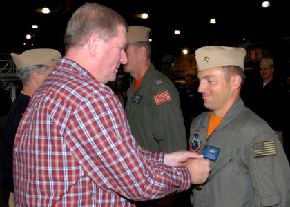 US Navy 080926-N-9860Y-003 Nate Patterson presents Chief Hospital Corpsman Greg Highfill with an Air Medal