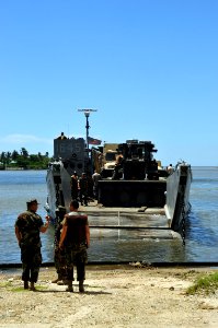 US Navy 081003-N-8907D-592 Assault Craft Unit (ACU) 2 personnel begin off loading vehicles and equipment