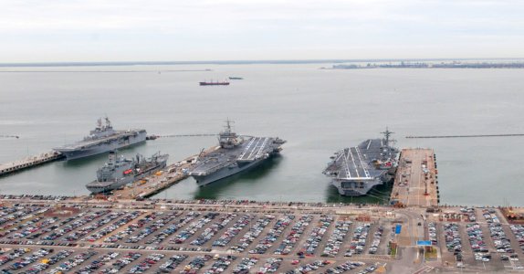 US Navy 101130-N-9589S-194 USS George H. W. Bush (CVN 77), right, and USS Enterprise (CVN 65) are docked at Naval Station Norfolk photo