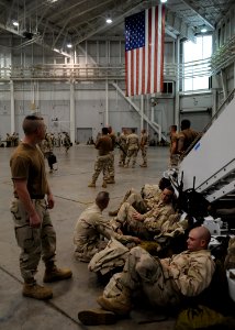 US Navy 080928-N-1120L-018 Seabees wait to board their aircraft prior to their deployment