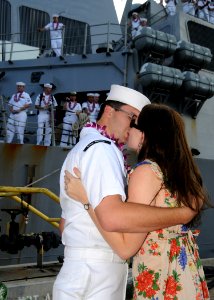 US Navy 081001-N-9758L-125 Sonar Technician (Surface) 3rd Class Andreas Arredondo kisses his wife during a first kiss ceremony pier side onboard Naval Station (NAVSTA) Pearl Harbor