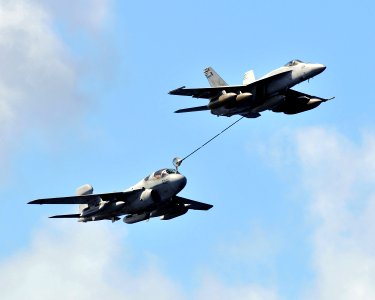 US Navy 080929-N-7981E-379 An F-A-18E Super Hornet refuels an EA-6B Prowler