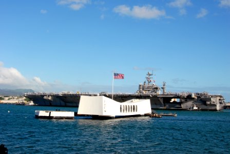 US Navy 080930-N-5476H-008 The Nimitz-class aircraft carrier USS Abraham Lincoln (CVN 72) renders honors to the USS Arizona Memorial as the ship enters Pearl Harbor Naval Station for a brief port visit