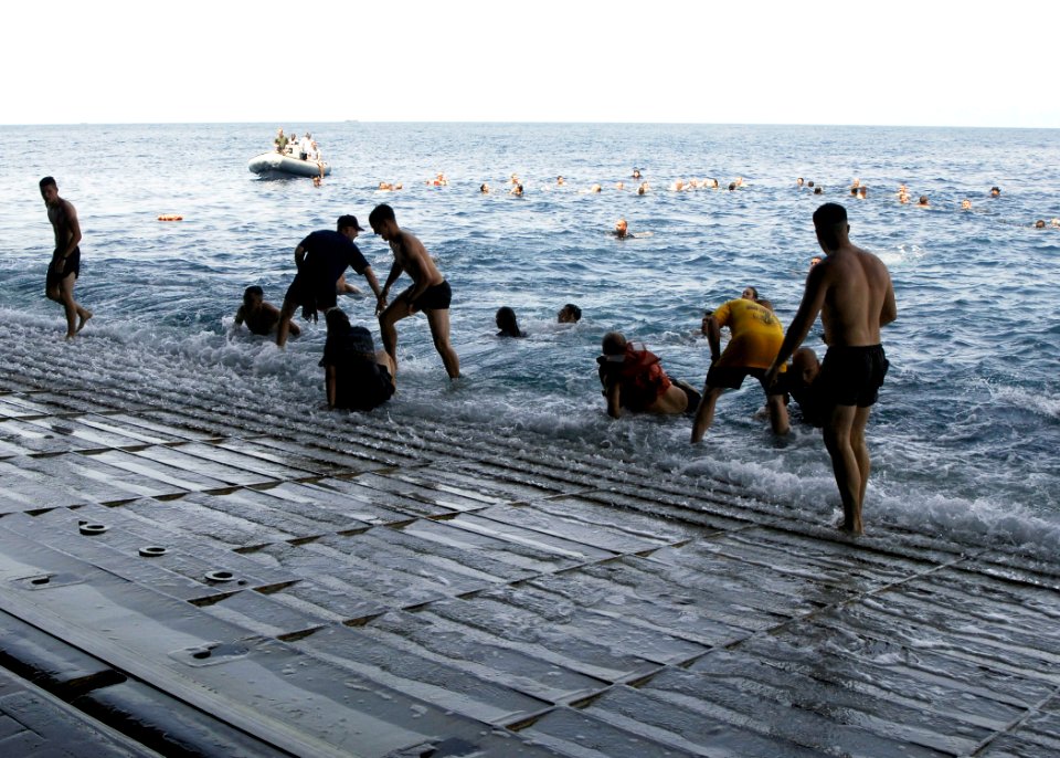 US Navy 081005-N-4236E-021 ailors and Marines participate in a swim call aboard the amphibious assault ship USS Iwo Jima (LHD 7)
