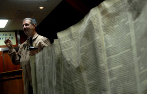 US Navy 081006-N-4005H-097 Cmdr. Joel Newman, a Rabbi aboard the Nimitz-class aircraft carrier USS Ronald Reagan (CVN 76), explains the Torah in the ships chapel during an introduction class to the Jewish religious holiday of Y