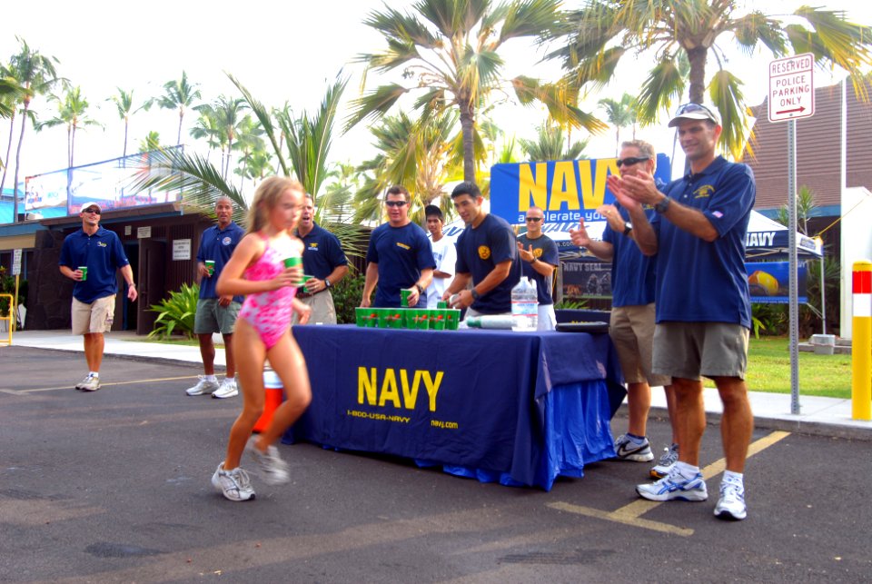 US Navy 081007-N-0995C-011 Members of the Naval Special Warfare community hand out water and cheer on children competing in the Ironkids Biathlon at Kailua-Kona