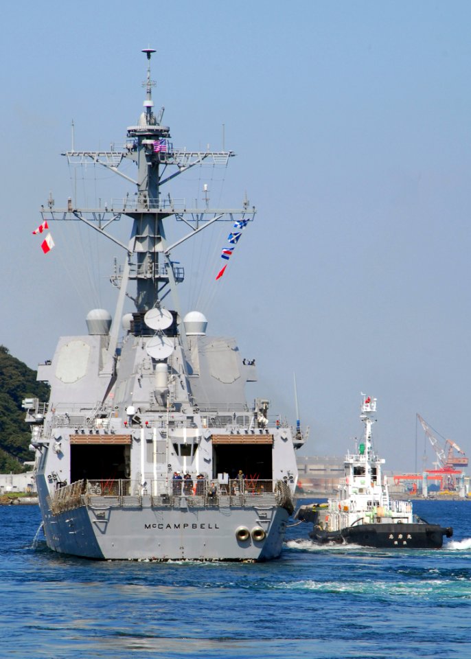 US Navy 081002-N-0483B-008 A Japanese harbor tug assists the Arleigh Burke-class guided-missile destroyer USS McCampbell (DDG 85)