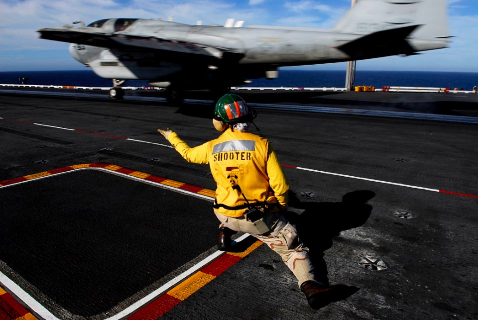 US Navy 081002-N-0684R-129 Aircraft launching officer Lt. Cmdr. Katrina Hill, from Gamber, Md., launches an EA-6B Prowler assigned to the