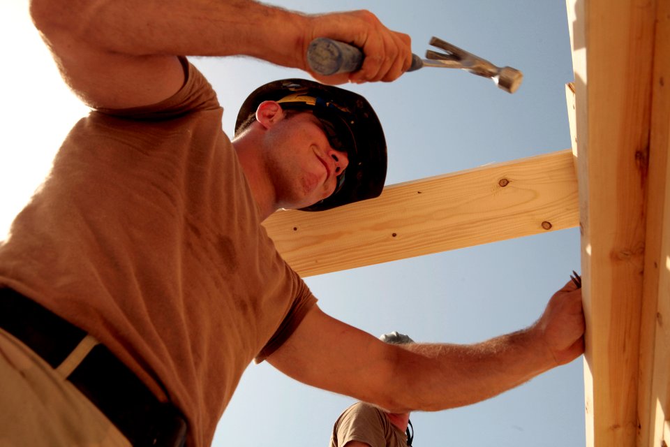 US Navy 081006-N-9623R-023 Builder Constructionman Recruit Robert Leroux works framing a roof on a South West Asia hut