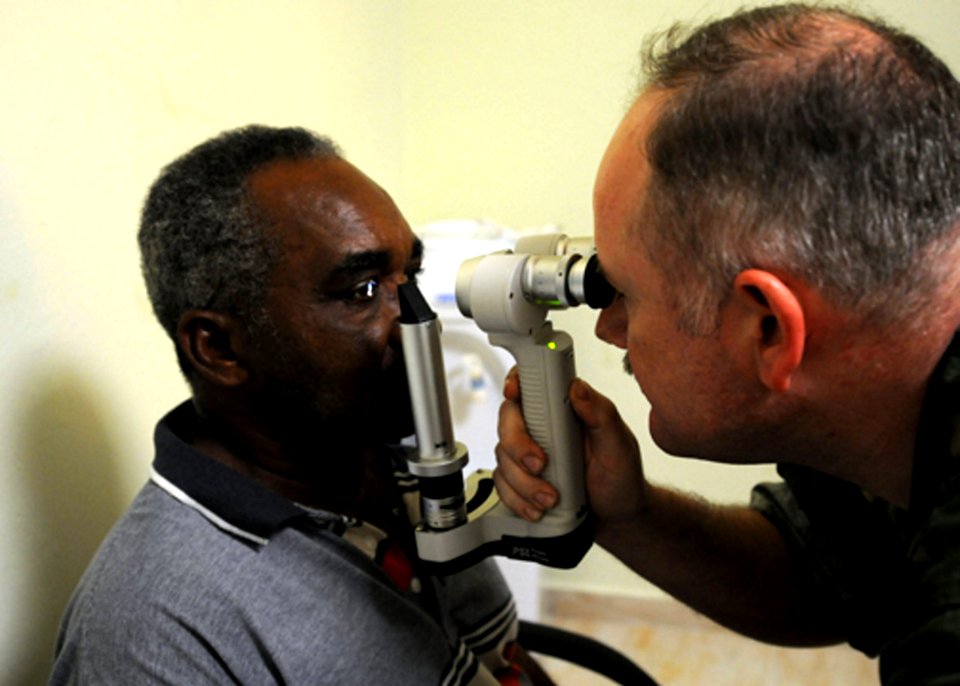 US Navy 081009-N-7955L-041 Cmdr. Brian Alexander performs an eye exam