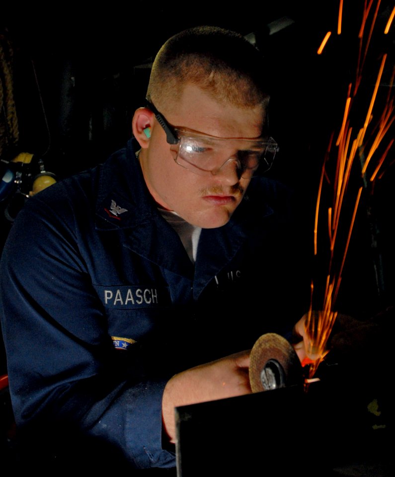 US Navy 081008-N-9610C-039 Hull Technician 3rd Class Robert Paasch, from Parkdale, Ore., makes a shipboard manhole cover in the engineering department machine shop aboard the Nimitz-class aircraft carrier USS John C. Stennis (C