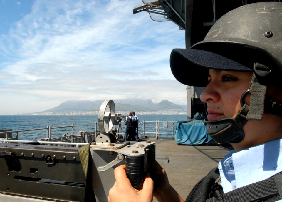 US Navy 081007-N-2456S-011 Aviation Ordnanceman 3rd Class Bianca Zamora stands the .50-caliber gun mount watch while the aircraft carrier USS Theodore Roosevelt (CVN 71) and crew depart Cape Town