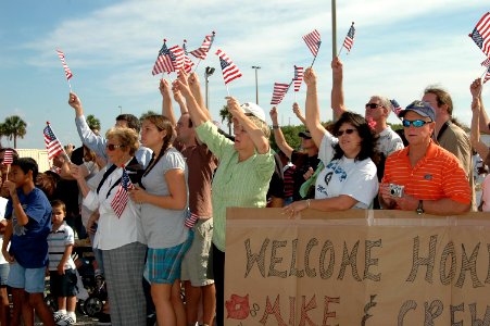US Navy 081005-N-1522S-004 Friends and family cheer as Sailors aboard the guided-missile frigate USS McInerney (FFG 8) return to homeport at Naval Station Mayport after a six-month deployment