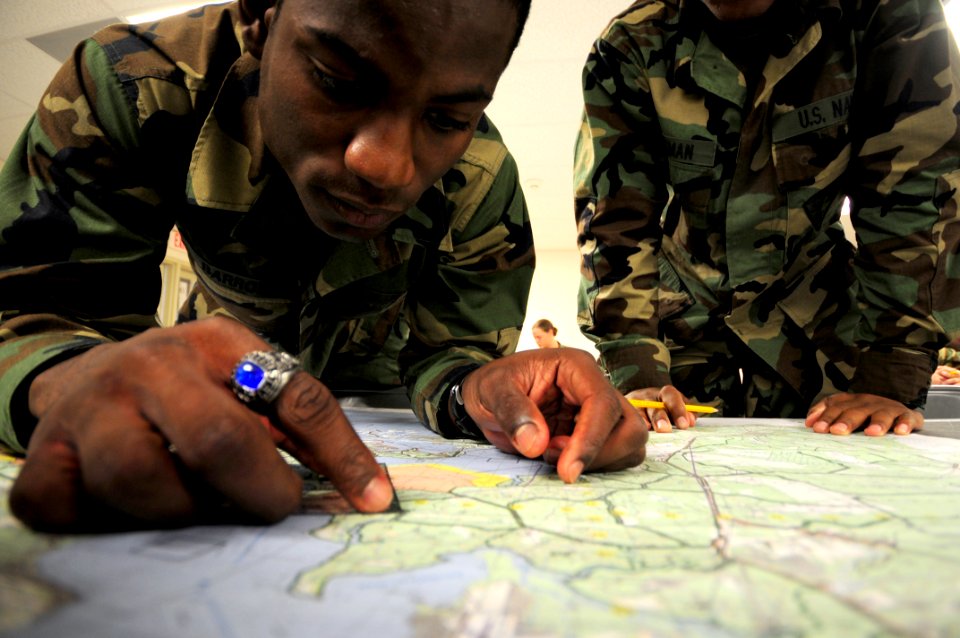 US Navy 081009-N-0411D-001 Construction Electrician Ricardo Barrow practices his land navigation skills during a Navy Expeditionary Combat Skills School training exercise