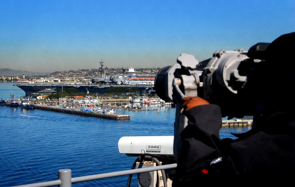 US Navy 081007-N-4774B-068 A Sailor aboard the amphibious assault ship USS Boxer (LHD 4) observes the aircraft carrier USS Midway Museum