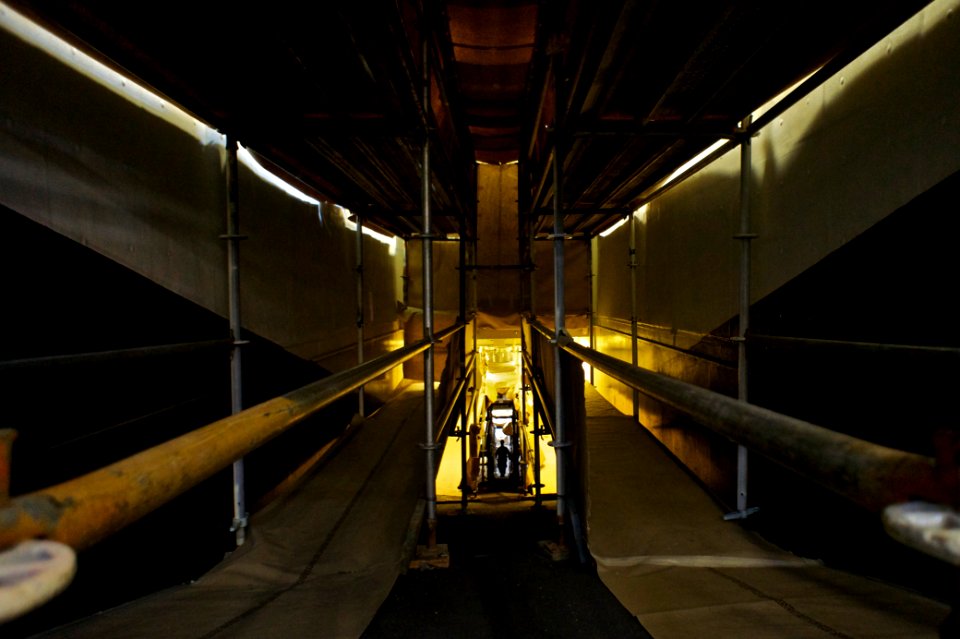 US Navy 101118-N-9643K-856 A Sailor ascends through scaffolding on the vehicle ramp aboard the amphibious assault ship USS Bonhomme Richard (LHD 6
